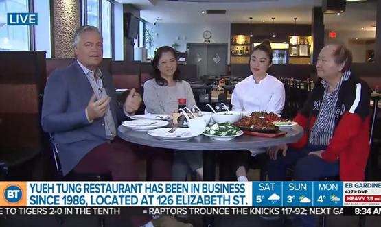 A screen shot of Breakfast Television of a man interviewing three people